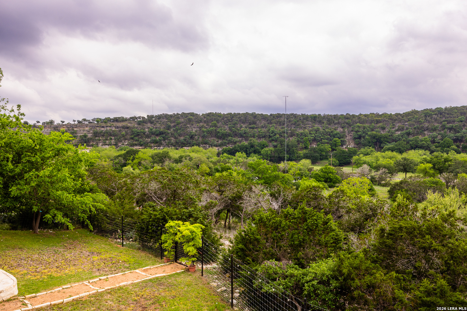 201 Cedar Cliff Loop West Hunt, TX 78024 - Photo 28 of 33 a view of a city with lush green forest