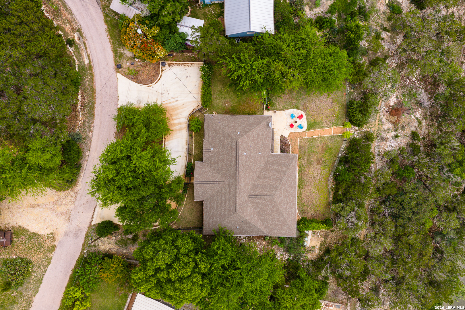 201 Cedar Cliff Loop West Hunt, TX 78024 - Photo 30 of 33 an aerial view of a house with outdoor space and trees all around