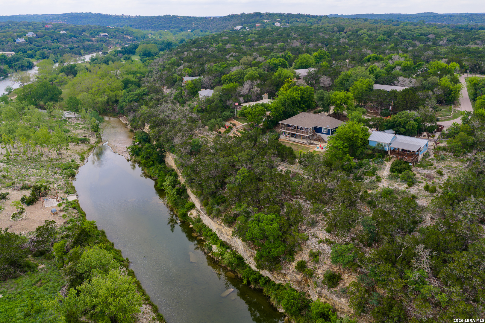 201 Cedar Cliff Loop West Hunt, TX 78024 - Photo 3 of 33 an aerial view of residential houses with outdoor space and trees