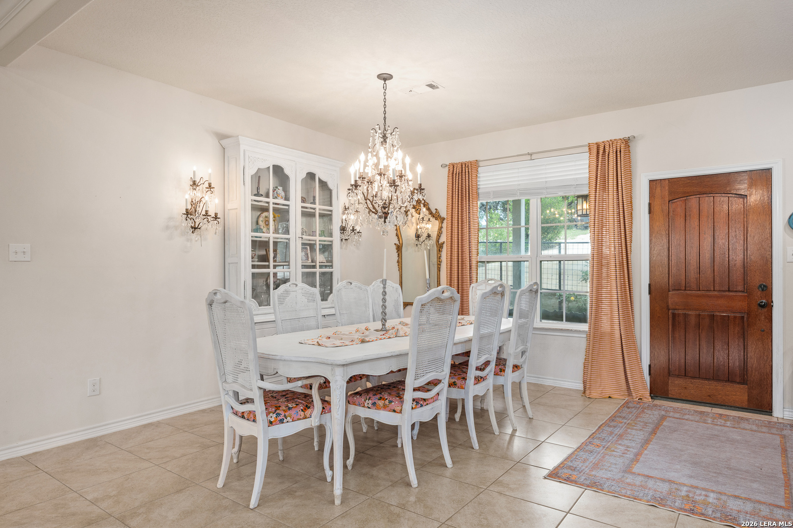 201 Cedar Cliff Loop West Hunt, TX 78024 - Photo 8 of 33 a dining room with furniture a chandelier and window