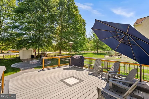 a view of a patio with a table and chairs