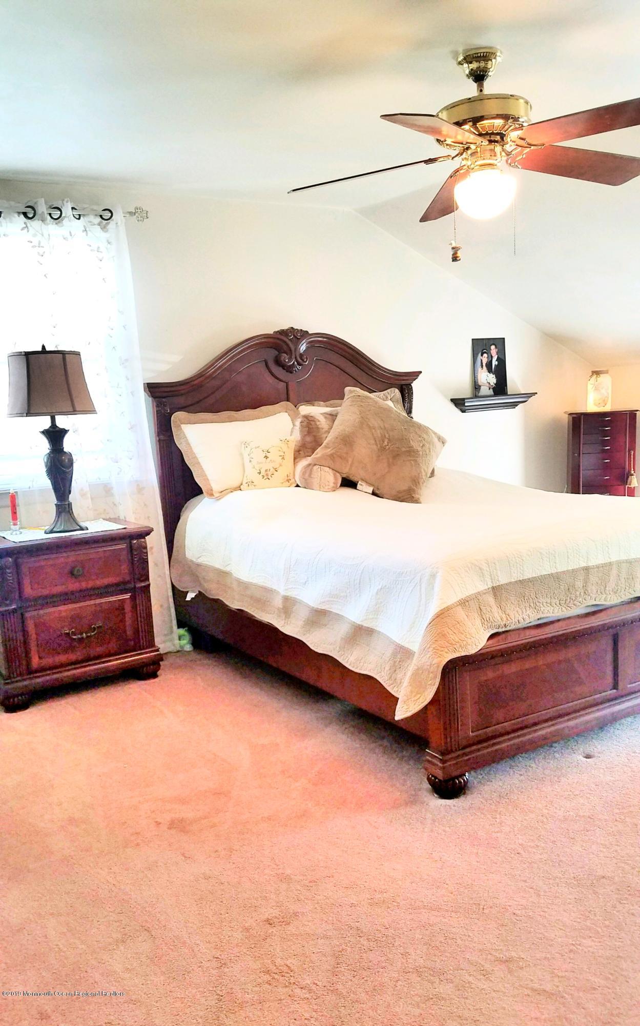 42 Bolton Road Hamilton, NJ 08610 - Photo 18 of 22 a bedroom with a bed and a lamp on the dresser