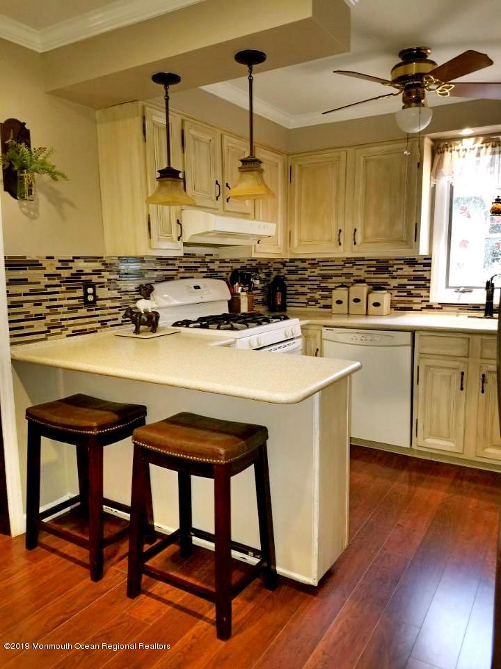 42 Bolton Road Hamilton, NJ 08610 - Photo 6 of 22 a kitchen with a table chairs sink and cabinets