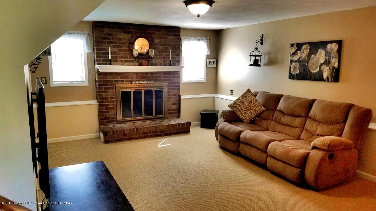 42 Bolton Road Hamilton, NJ 08610 - Photo 9 of 22 a living room with furniture and a fireplace