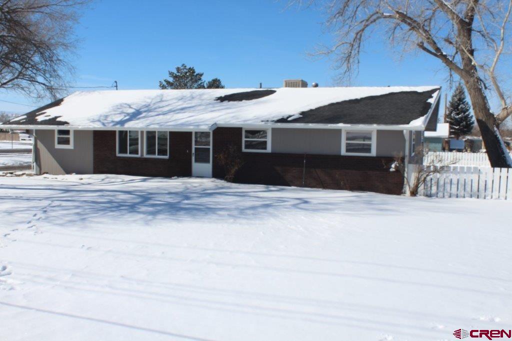 1191 Pioneer Road Delta, CO 81416 - Photo 1 of 22 a front view of house with yard