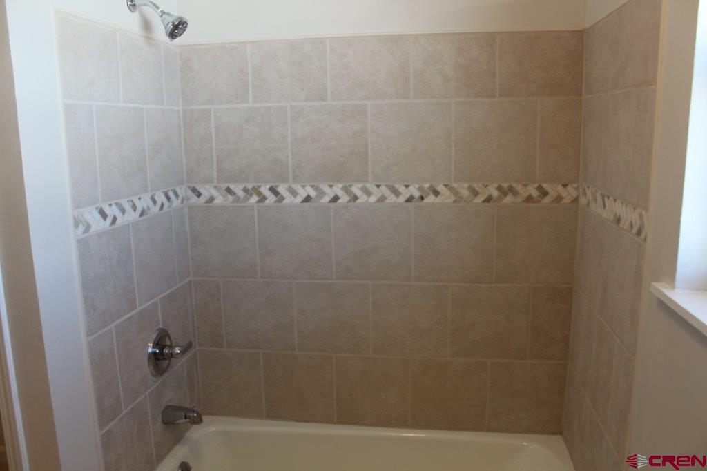 1191 Pioneer Road Delta, CO 81416 - Photo 12 of 22 a bathroom with a shower