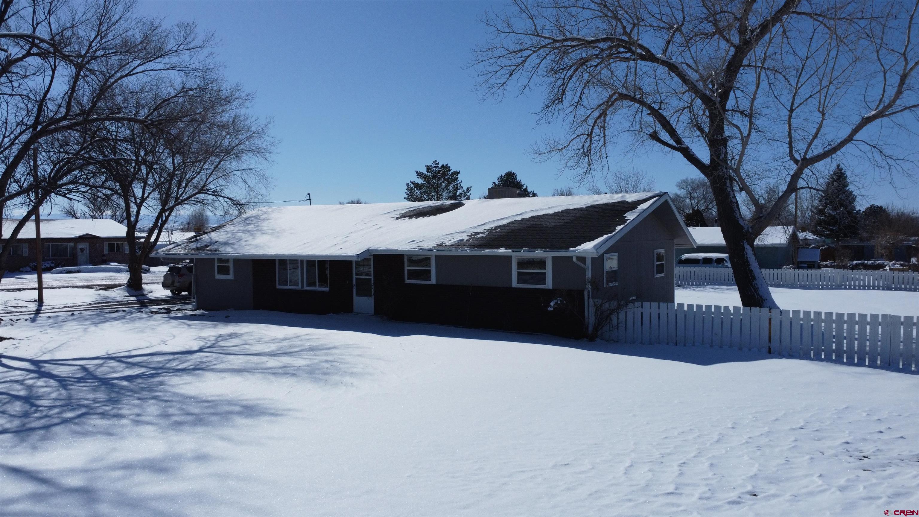 1191 Pioneer Road Delta, CO 81416 - Photo 17 of 22 a front view of a house with a yard