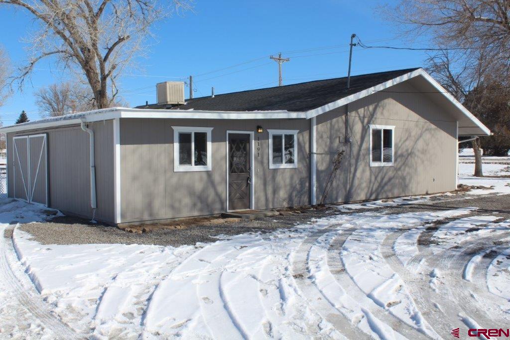 1191 Pioneer Road Delta, CO 81416 - Photo 3 of 22 a front view of a house with a yard