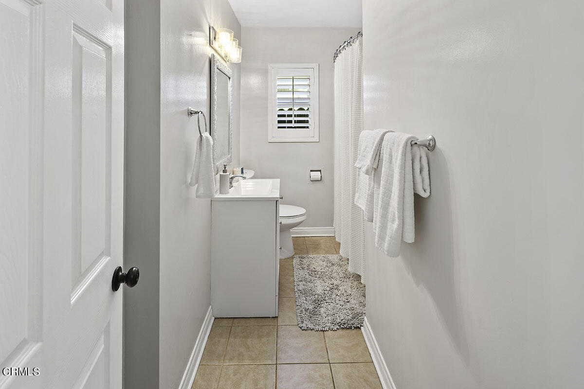 223 Marathon Road Altadena, CA 91001 - Photo 17 of 31 a bathroom with a sink and mirror