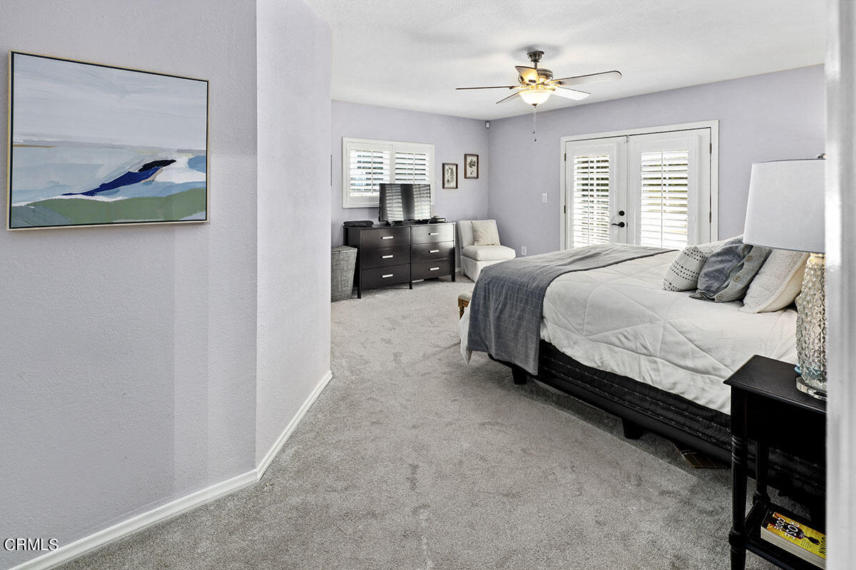 223 Marathon Road Altadena, CA 91001 - Photo 20 of 31 a bedroom with a bed and a chandelier