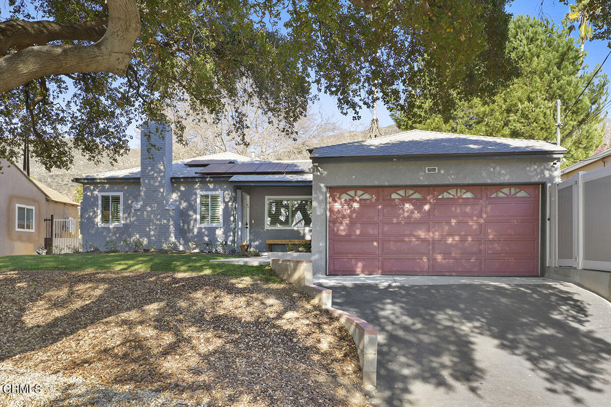 223 Marathon Road Altadena, CA 91001 - Photo 2 of 31 a front view of a house with a yard and garage