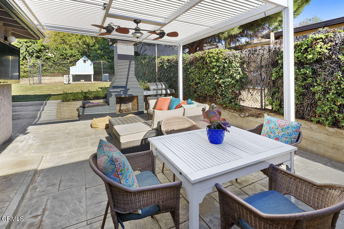223 Marathon Road Altadena, CA 91001 - Photo 26 of 31 a view of a patio with a table chairs and a small yard