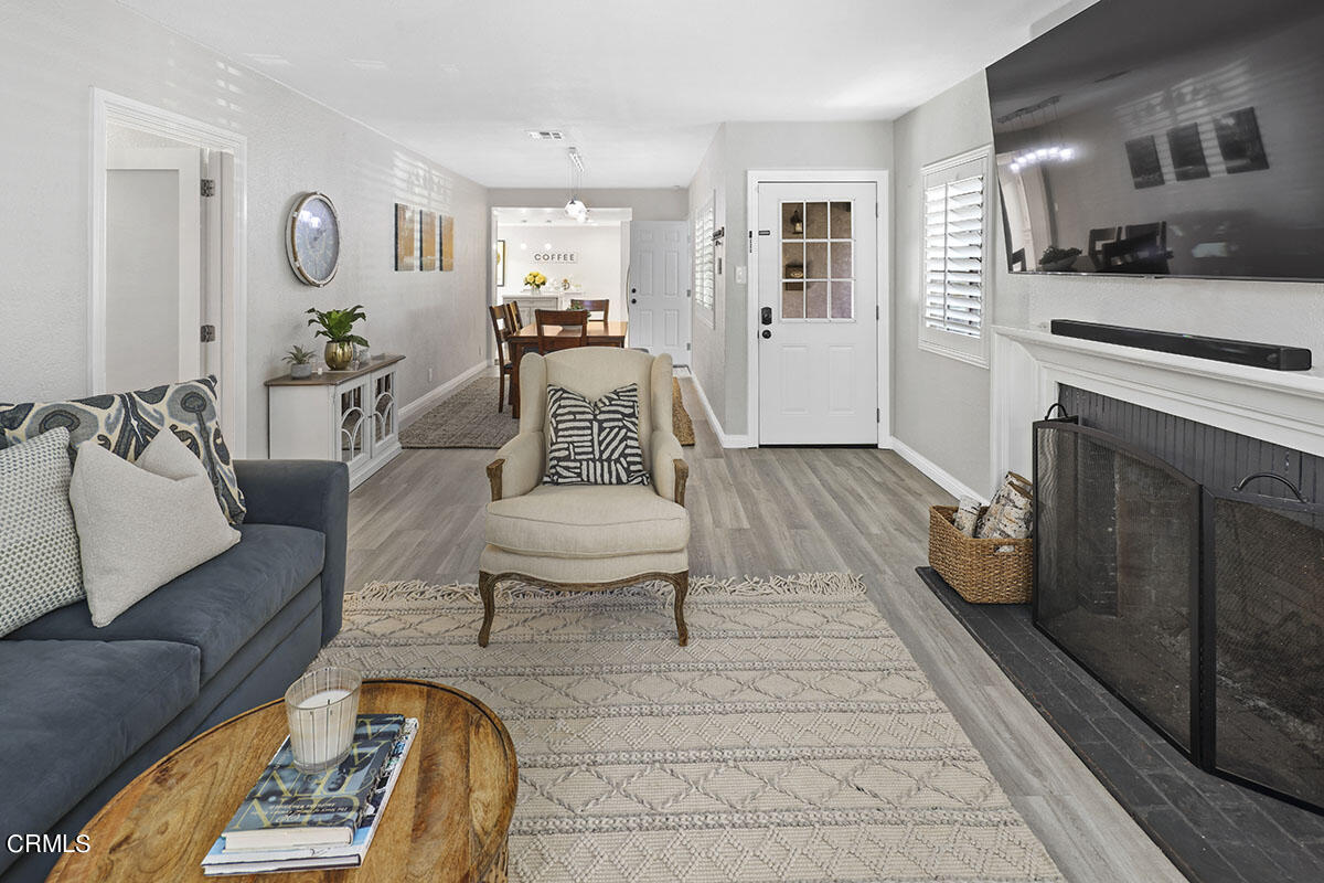 223 Marathon Road Altadena, CA 91001 - Photo 5 of 31 a living room with furniture and a fireplace