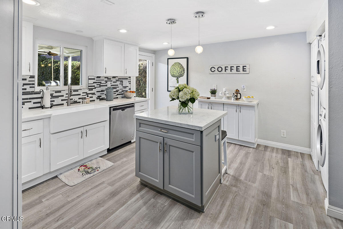 223 Marathon Road Altadena, CA 91001 - Photo 8 of 31 a kitchen with sink cabinets and wooden floor