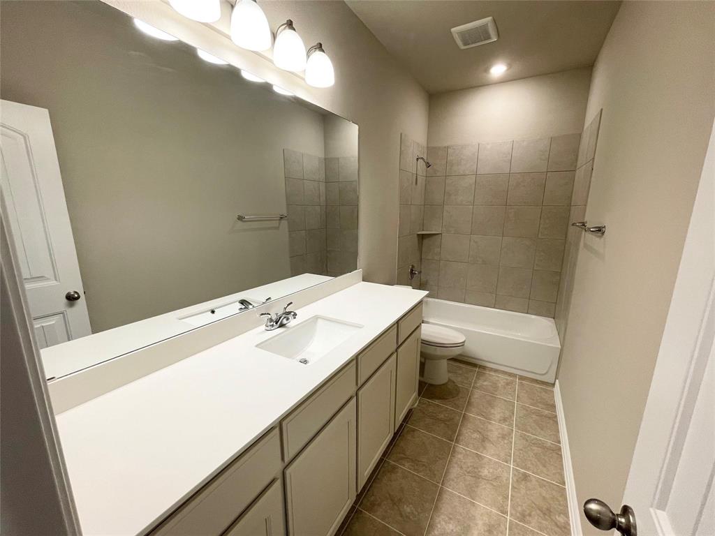 832 Porcupine Drive Springtown, TX 76082 - Photo 12 of 16 a bathroom with a sink a toilet and shower