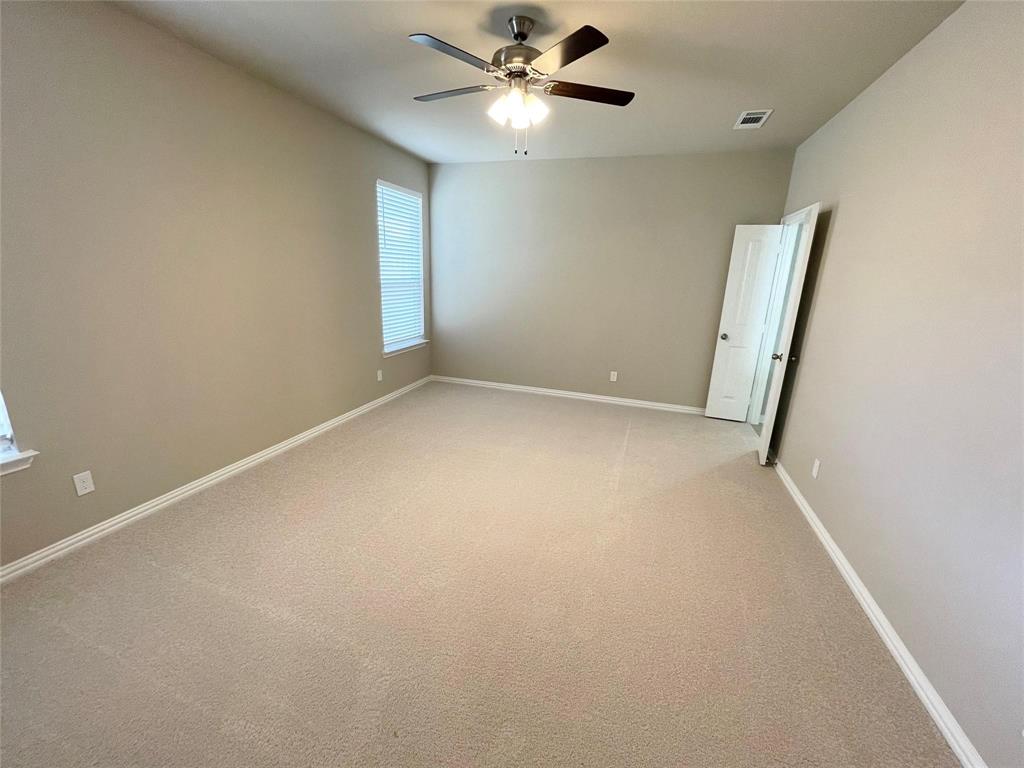 832 Porcupine Drive Springtown, TX 76082 - Photo 16 of 16 an empty room with a window and a fan