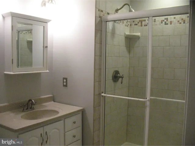 a bathroom with a sink and mirror