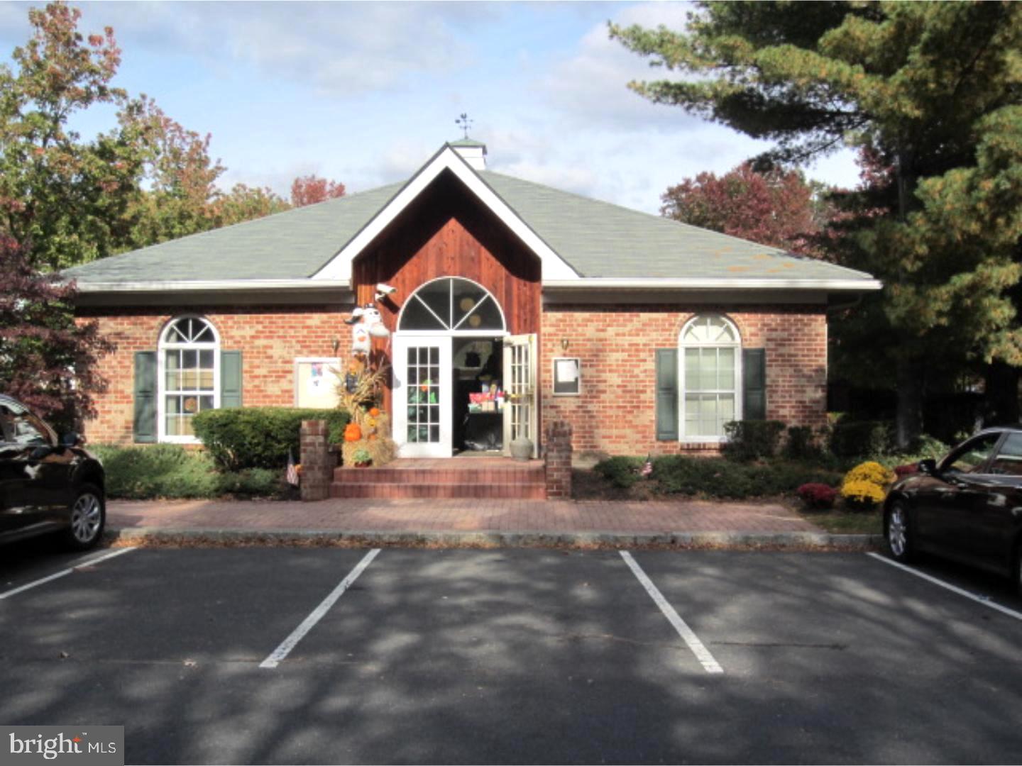 14 Versailles Court Hamilton, NJ 08619 - Photo 17 of 20 a front view of a house with a yard