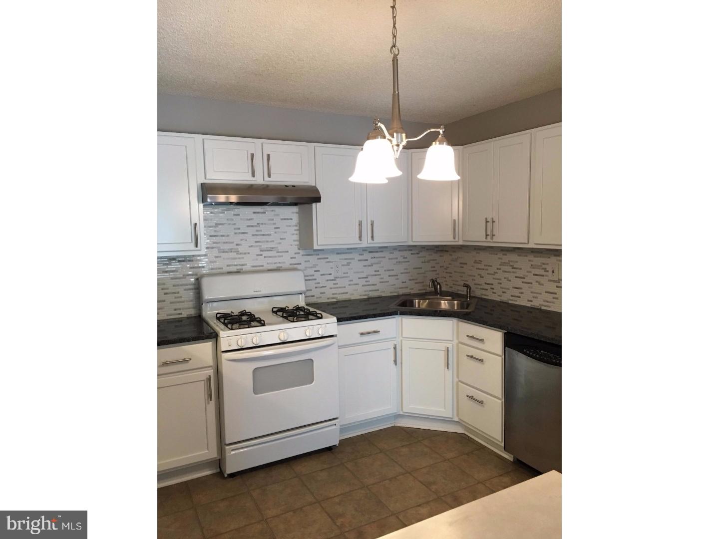 14 Versailles Court Hamilton, NJ 08619 - Photo 4 of 20 a kitchen with a sink cabinets and window