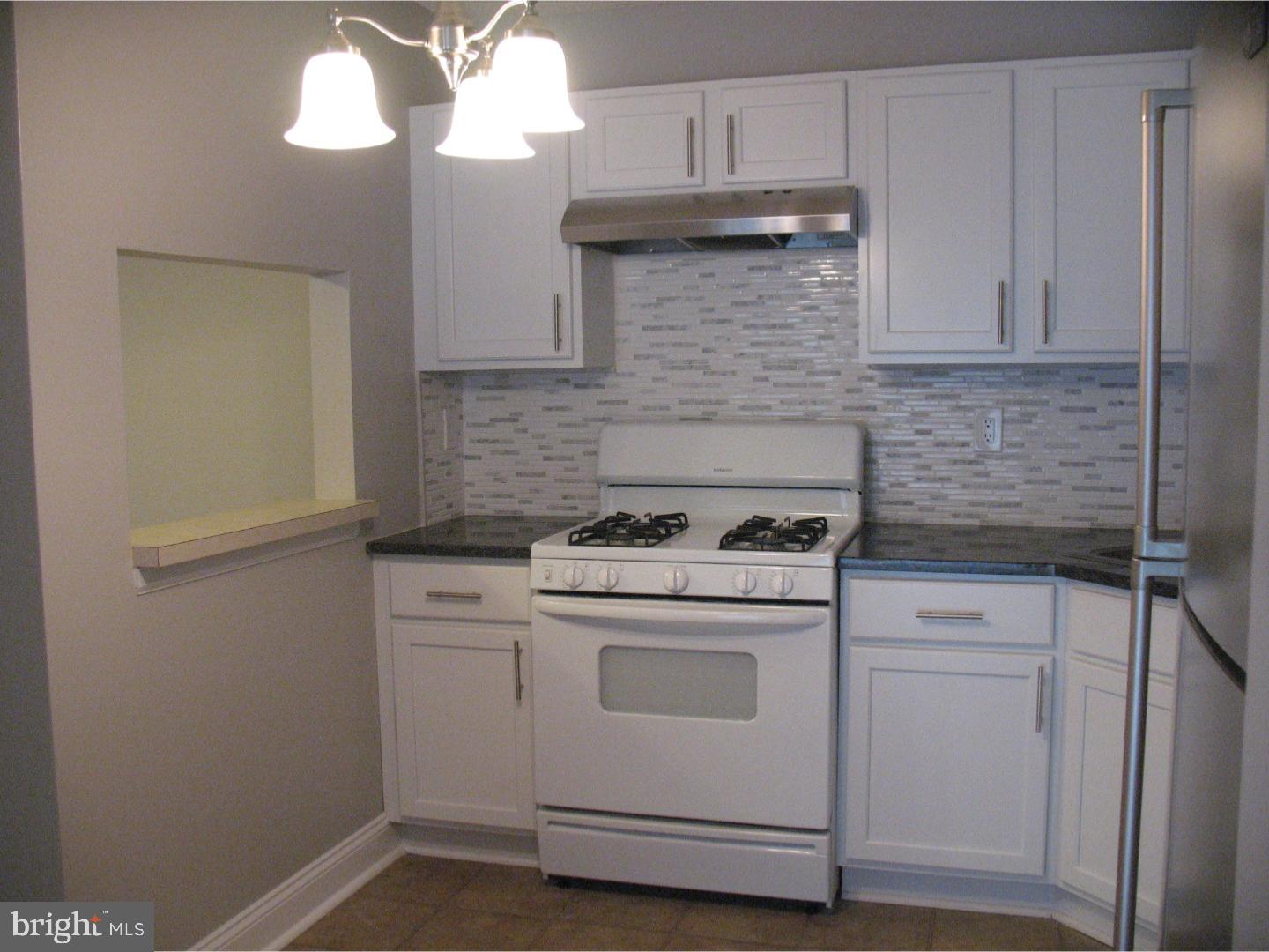 14 Versailles Court Hamilton, NJ 08619 - Photo 5 of 20 a kitchen with cabinets appliances and a sink