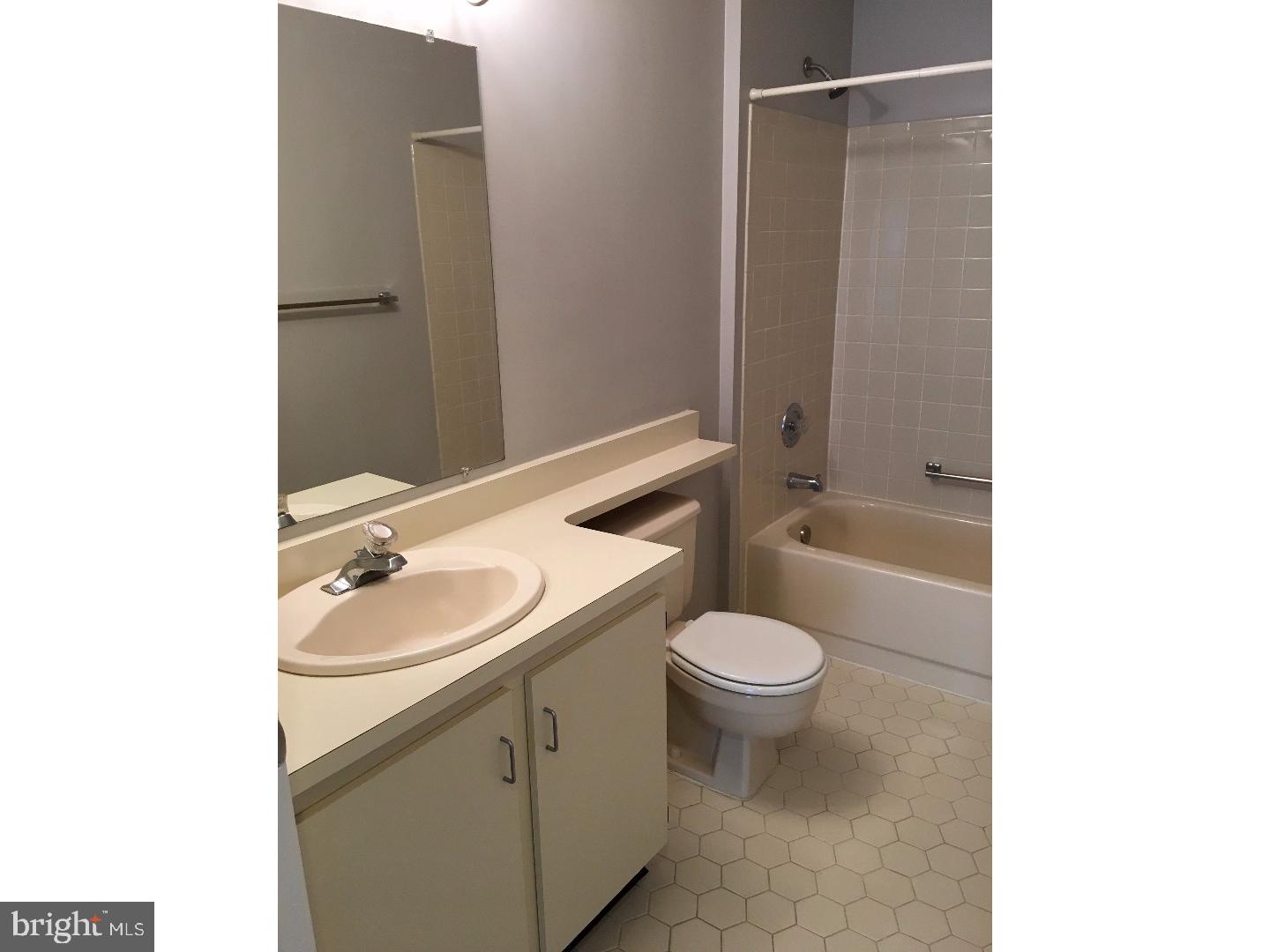 14 Versailles Court Hamilton, NJ 08619 - Photo 9 of 20 a bathroom with a sink toilet and shower