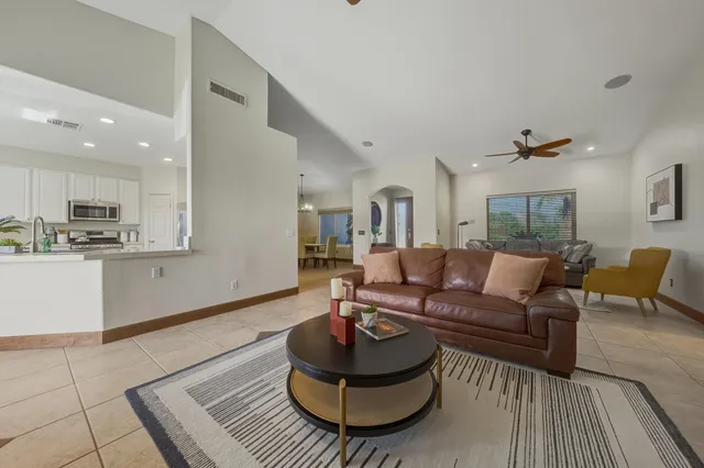 a living room with furniture and a rug