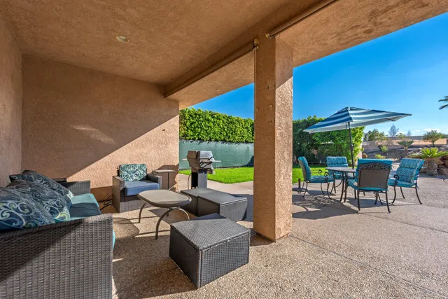 a outdoor space with patio the couches and dining table with potted plants