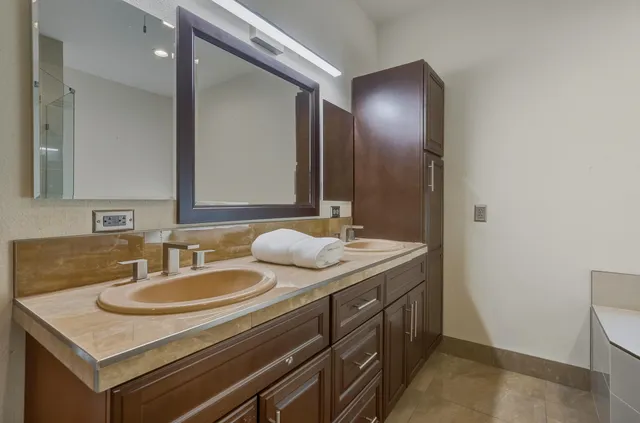 a bathroom with a sink and a mirror