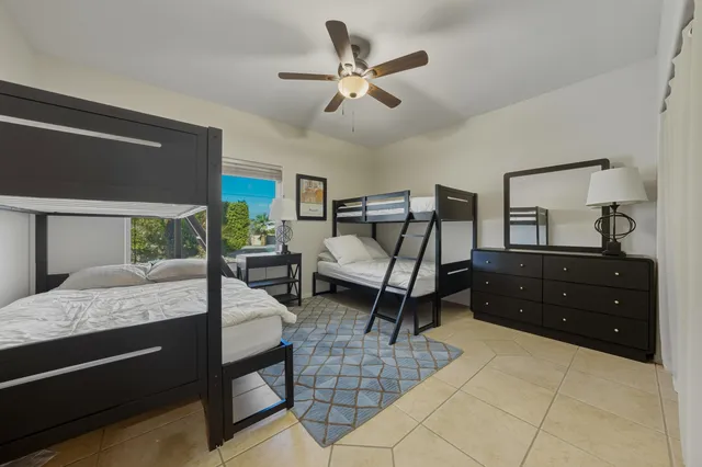 a bed room with a bed and a dresser