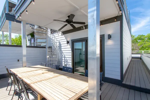 a patio with table and chairs