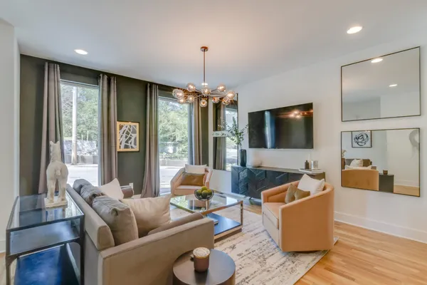 a living room with furniture and a flat screen tv