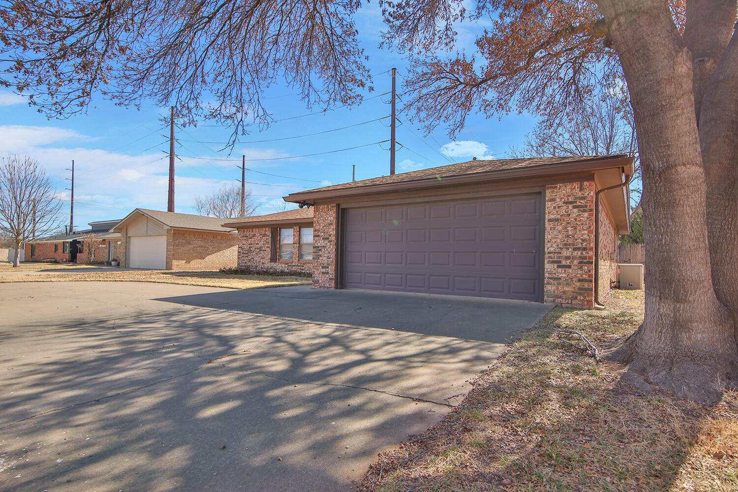 4805 73rd Street Lubbock, TX 79424 - Photo 3 of 26 a front view of a house with a yard
