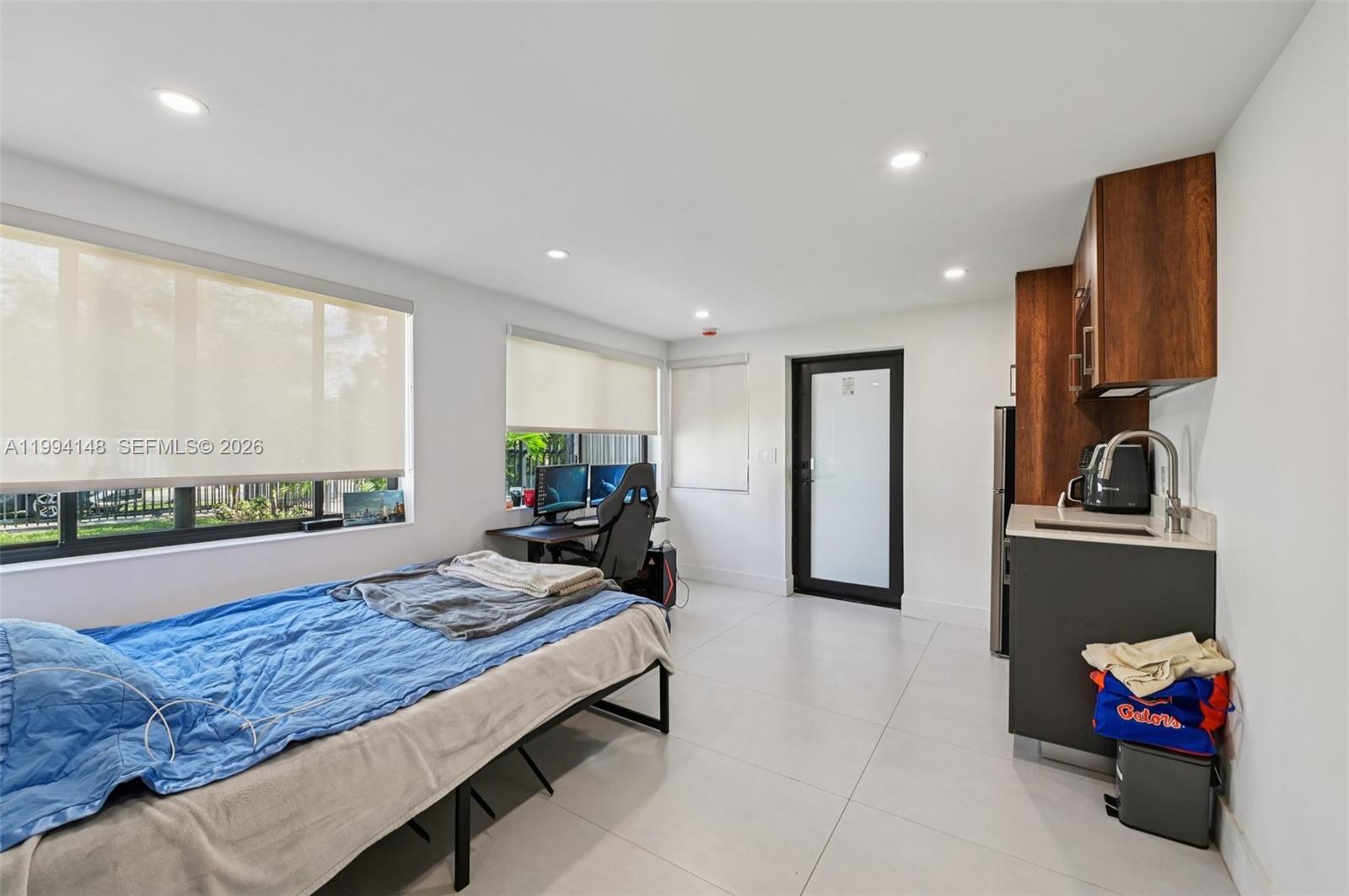 5152 Southwest 6th Street Miami, FL 33134 - Photo 19 of 43 a living room with furniture and a large window