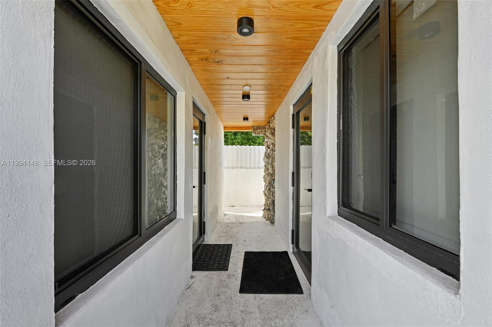 5152 Southwest 6th Street Miami, FL 33134 - Photo 20 of 43 a view of a hallway with windows