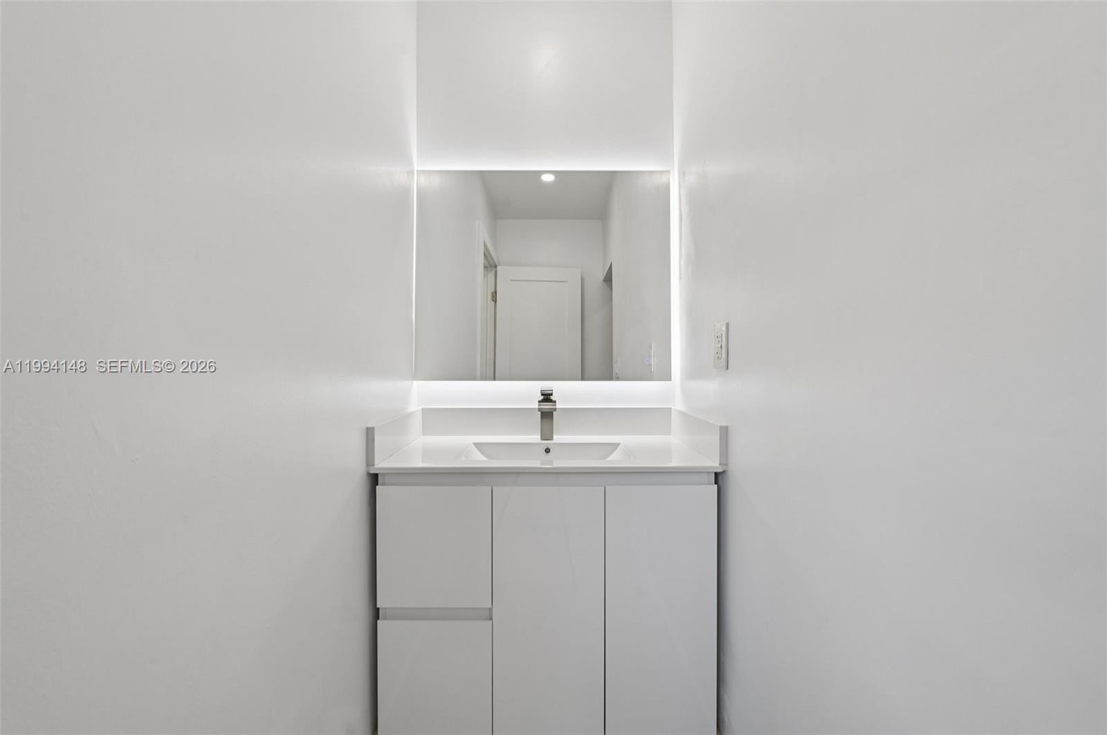 5152 Southwest 6th Street Miami, FL 33134 - Photo 21 of 43 a bathroom with a sink and a mirror