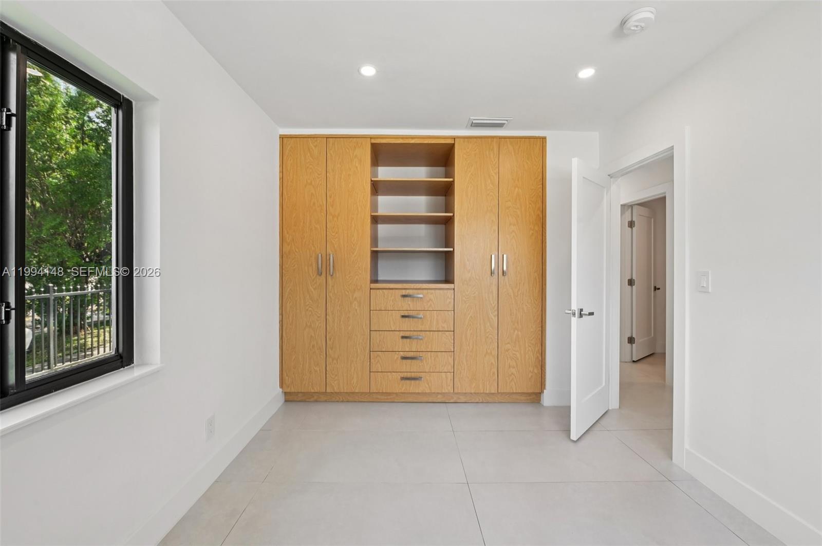 5152 Southwest 6th Street Miami, FL 33134 - Photo 23 of 43 an empty room with closet and window