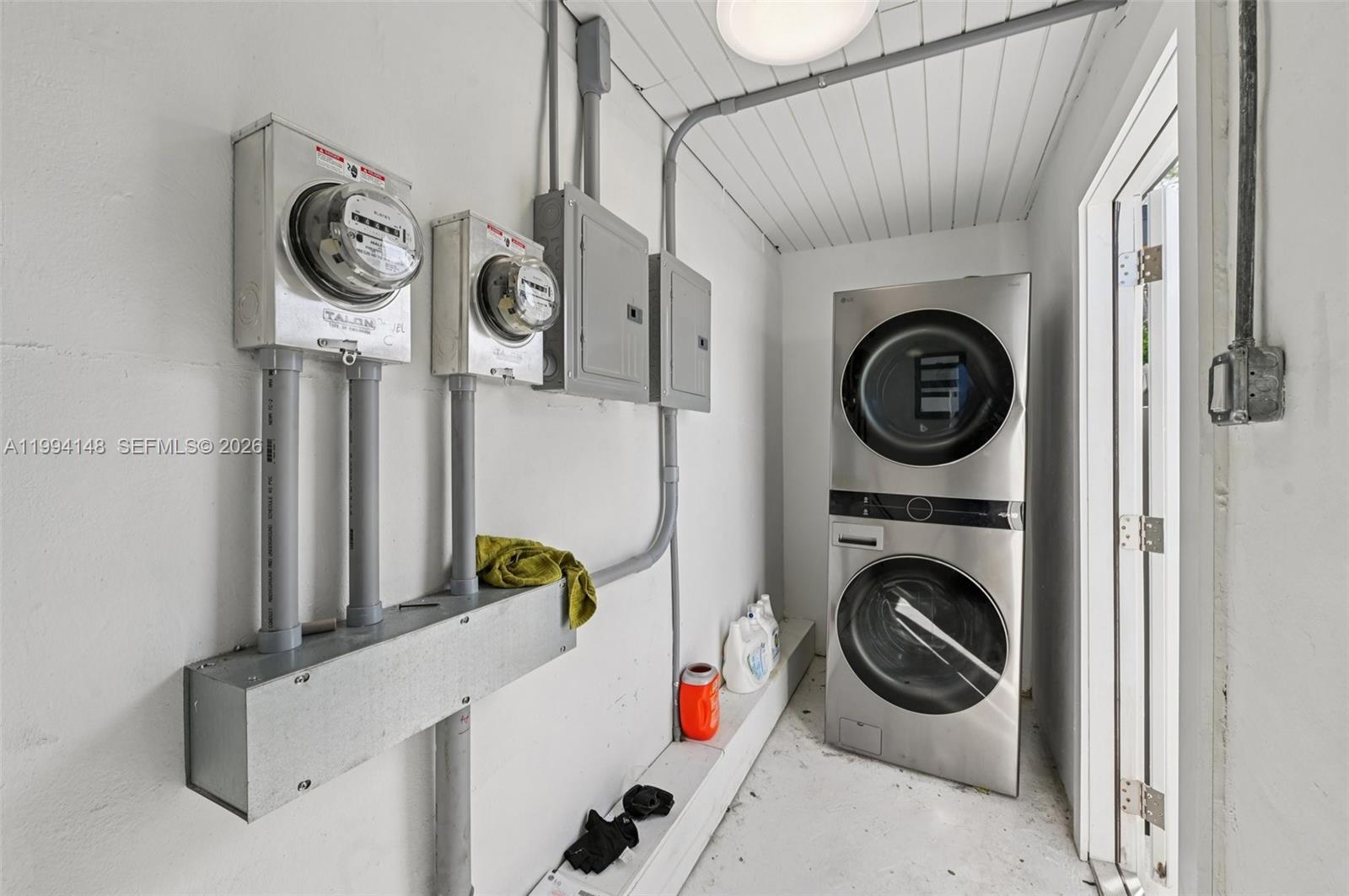 5152 Southwest 6th Street Miami, FL 33134 - Photo 41 of 43 a utility room with dryer and washer