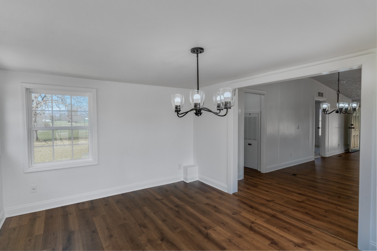 4214 Oregon Road Springfield, TN 37172 - Photo 14 of 37 an empty room with wooden floor cabinet and windows