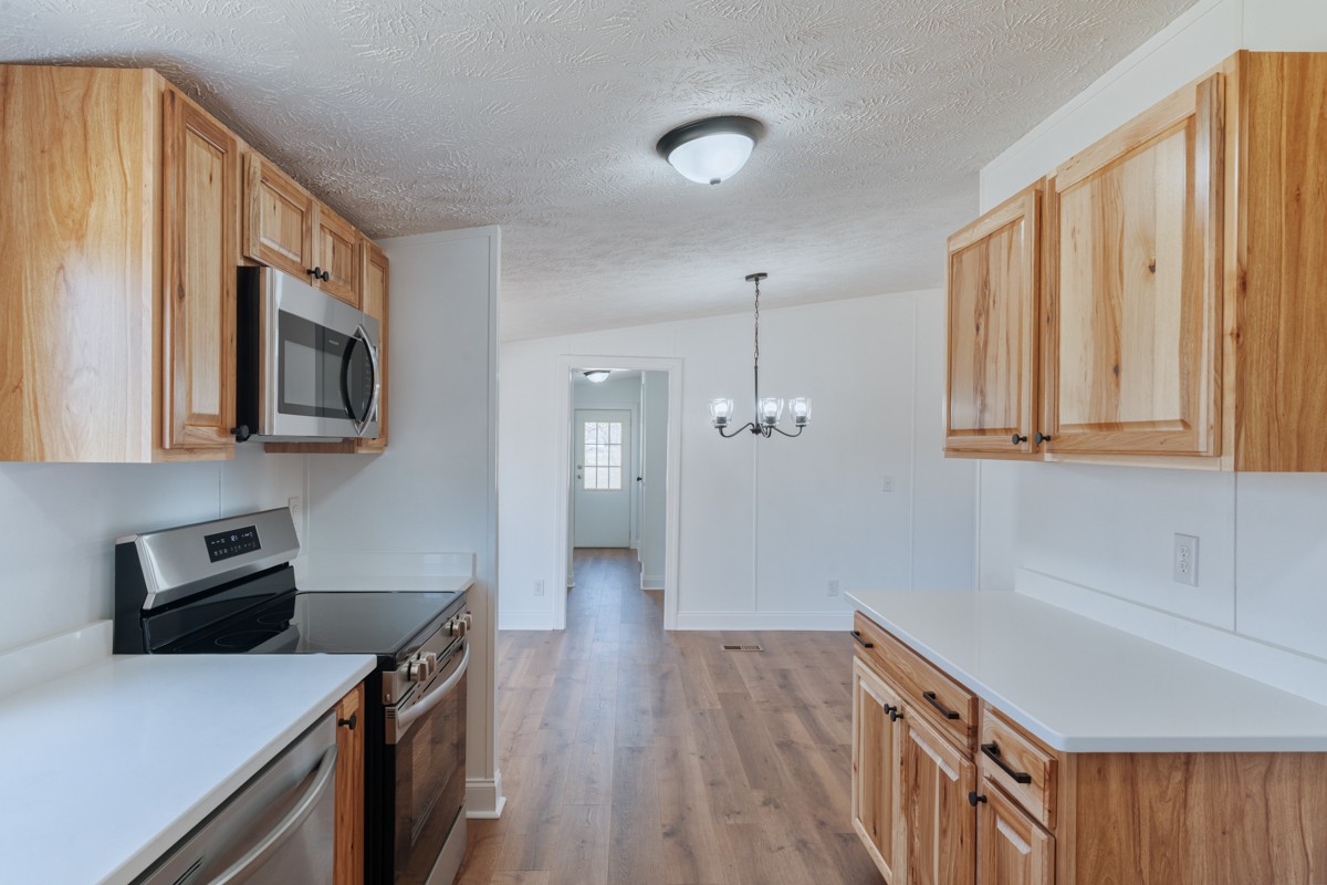 4214 Oregon Road Springfield, TN 37172 - Photo 19 of 37 a kitchen that has a microwave a sink and a stove in it