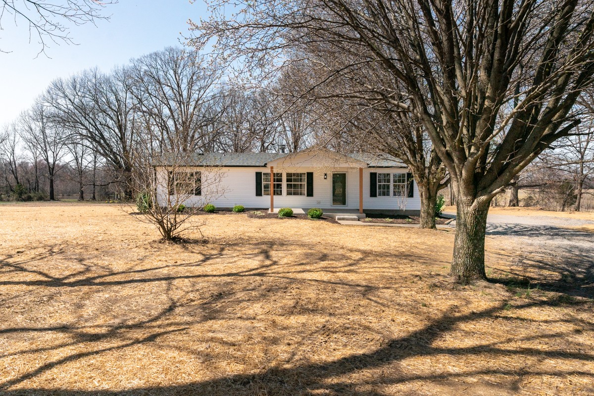 4214 Oregon Road Springfield, TN 37172 - Photo 2 of 37 a front view of a house with a yard covered in snow