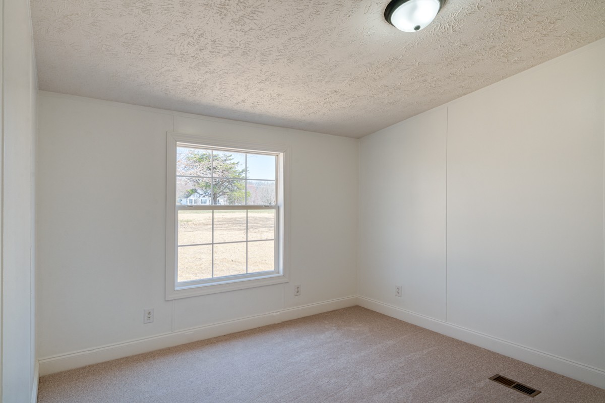 4214 Oregon Road Springfield, TN 37172 - Photo 21 of 37 an empty room with a window