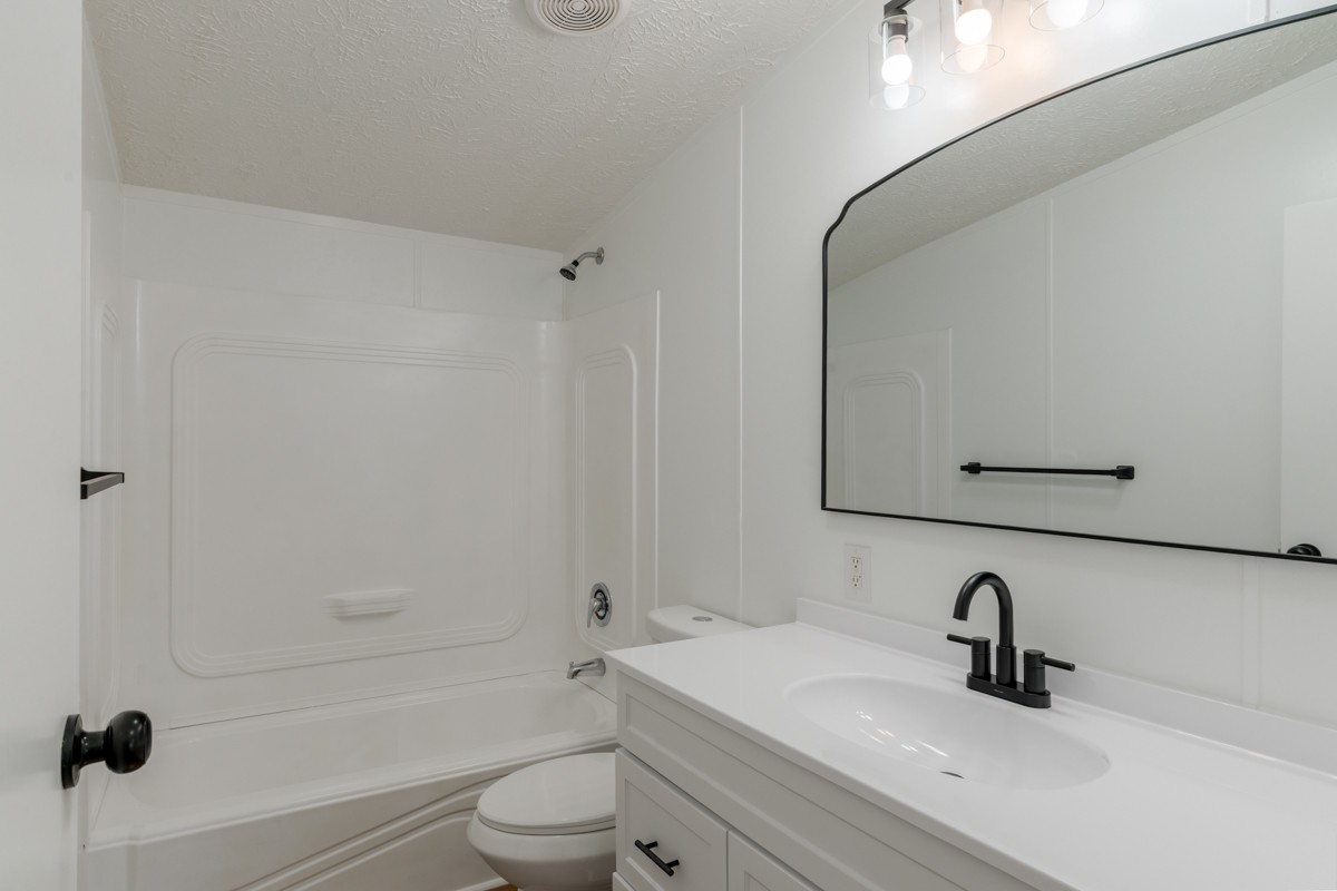 4214 Oregon Road Springfield, TN 37172 - Photo 30 of 37 a bathroom with a sink toilet a vanity and shower