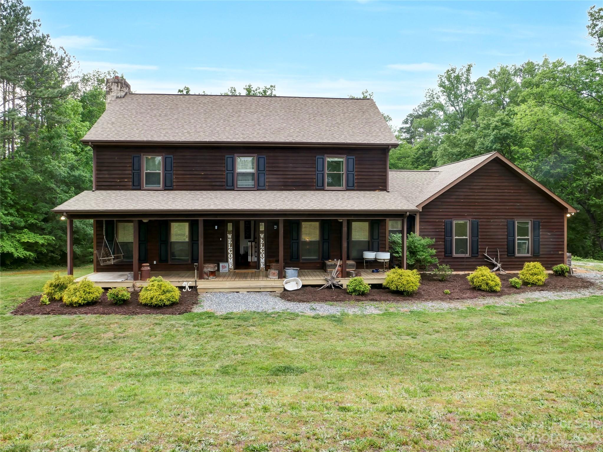 321 David Sims Road Rutherfordton, NC 28139 - Photo 1 of 47 a front view of a house with garden