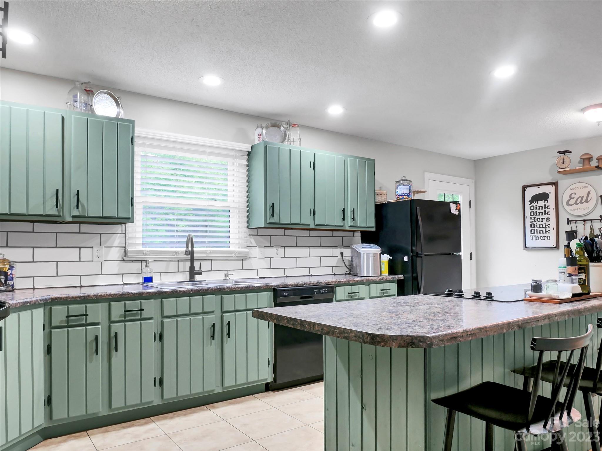 321 David Sims Road Rutherfordton, NC 28139 - Photo 16 of 47 a kitchen with a sink and cabinets