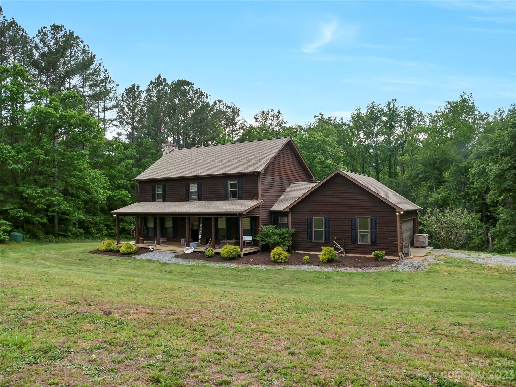 321 David Sims Road Rutherfordton, NC 28139 - Photo 4 of 47 a front view of a house with garden
