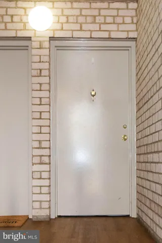 a view of an empty room and wooden floor