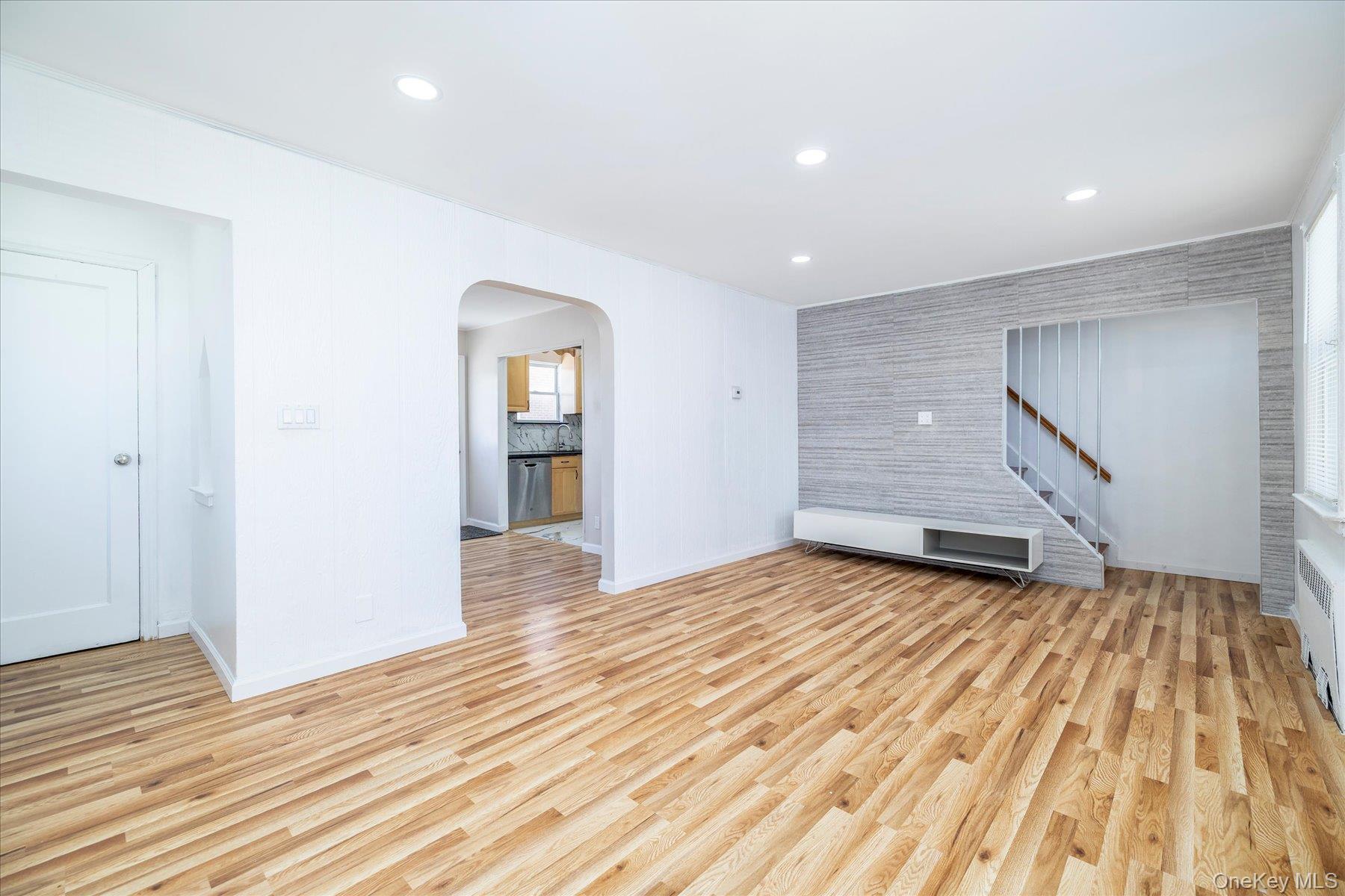 191 Raff Avenue Mineola, NY 11501 - Photo 11 of 25 a view of a room with wooden floor and stairs