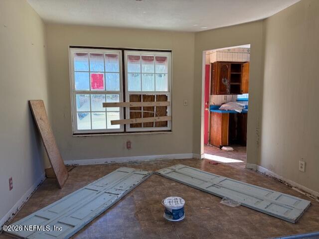 8002 Lenox Avenue Jacksonville, FL 32221 - Photo 20 of 20 a view of an empty room with window and hardwood floor