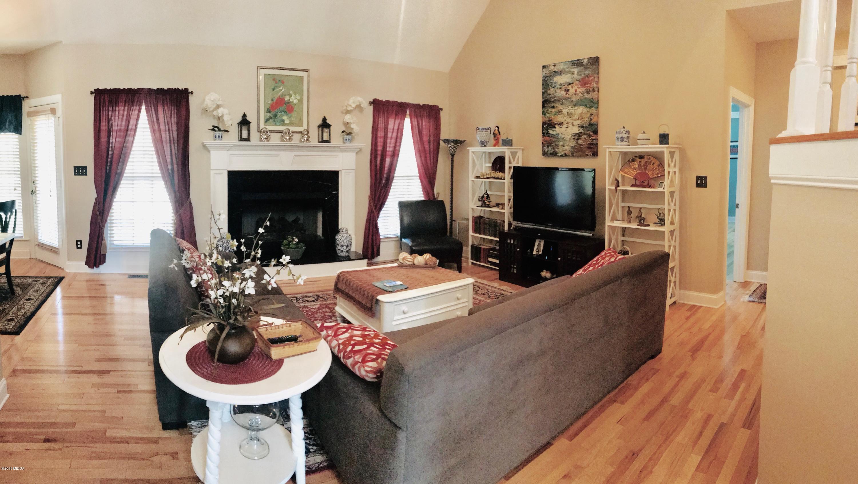 351 Eagle Ridge Road Macon, GA 31216 - Photo 2 of 33 a living room with furniture and a fireplace