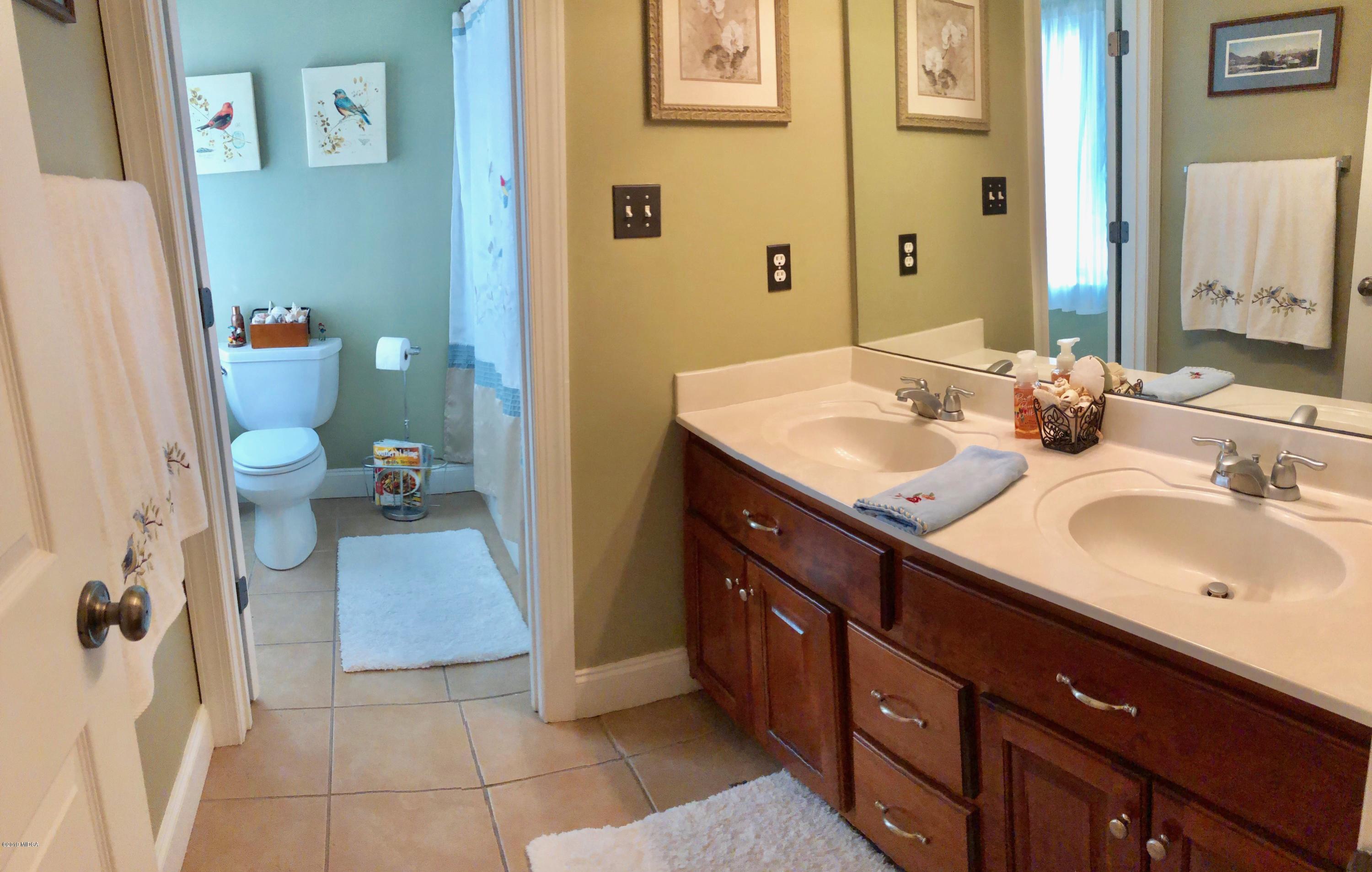 351 Eagle Ridge Road Macon, GA 31216 - Photo 19 of 33 a bathroom with a sink and a mirror